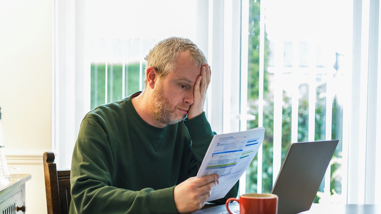 Man looking worried at bill