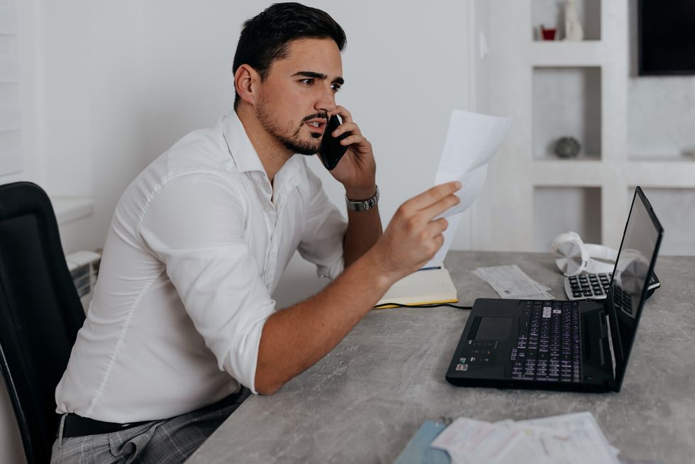 Man looking worried at bills