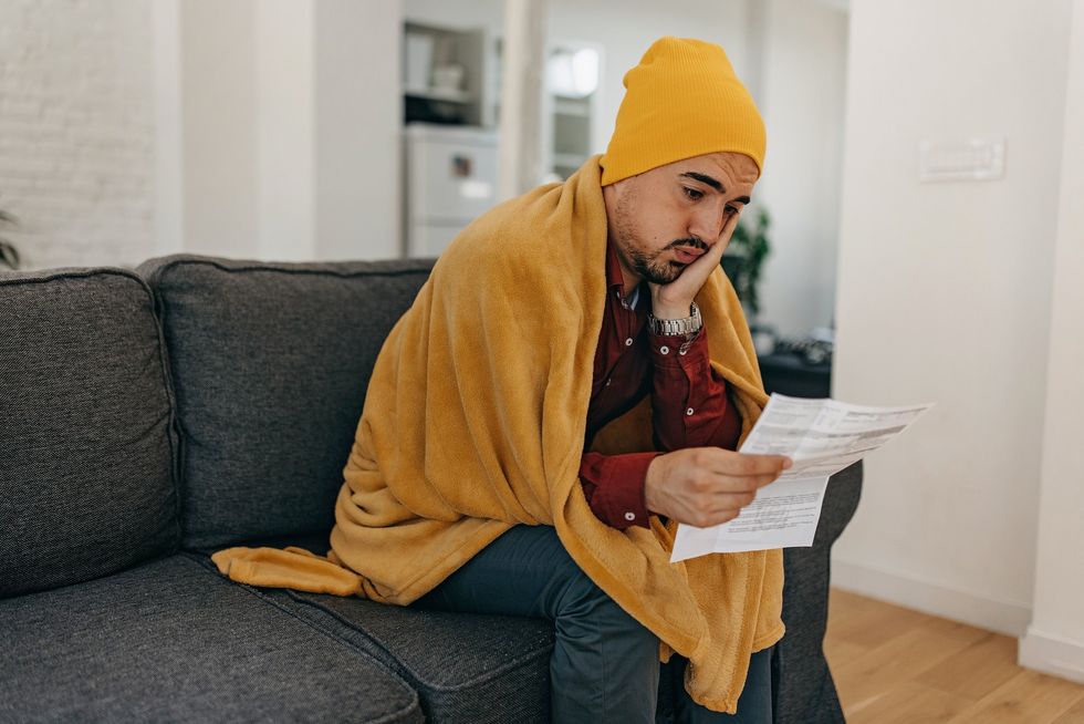 Man looking worried at energy bills