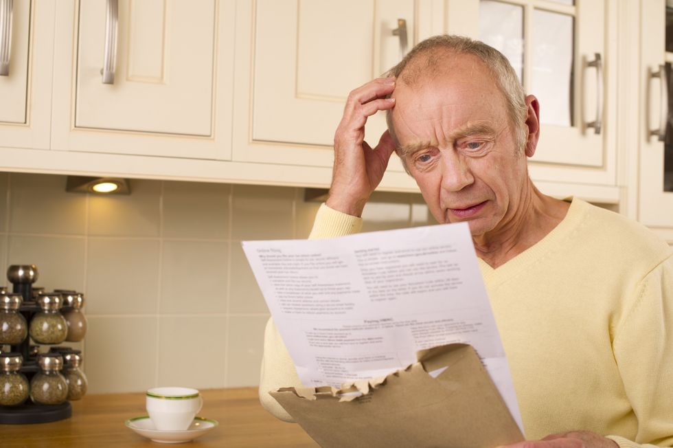 Man looking worried at letter