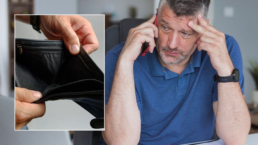Man looking worried while on the phone and empty wallet