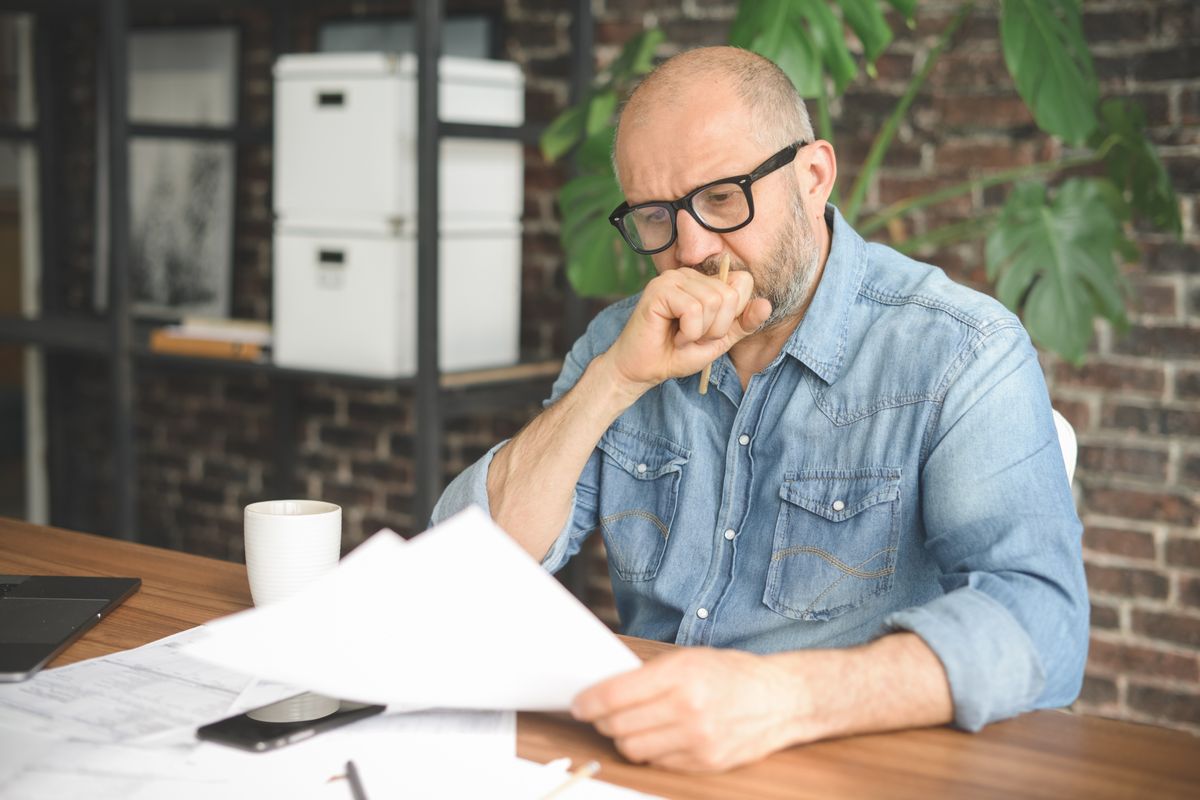 Man looks worried about tax letter