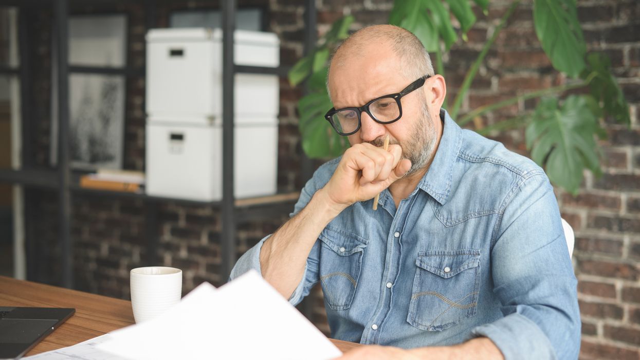 Man looks worried about tax letter