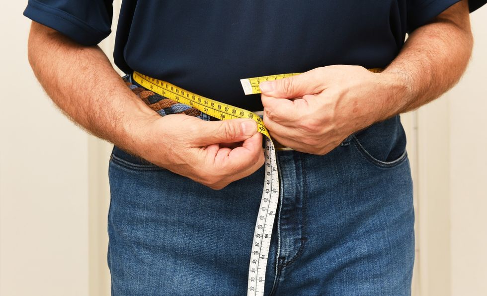 Man measuring his waist