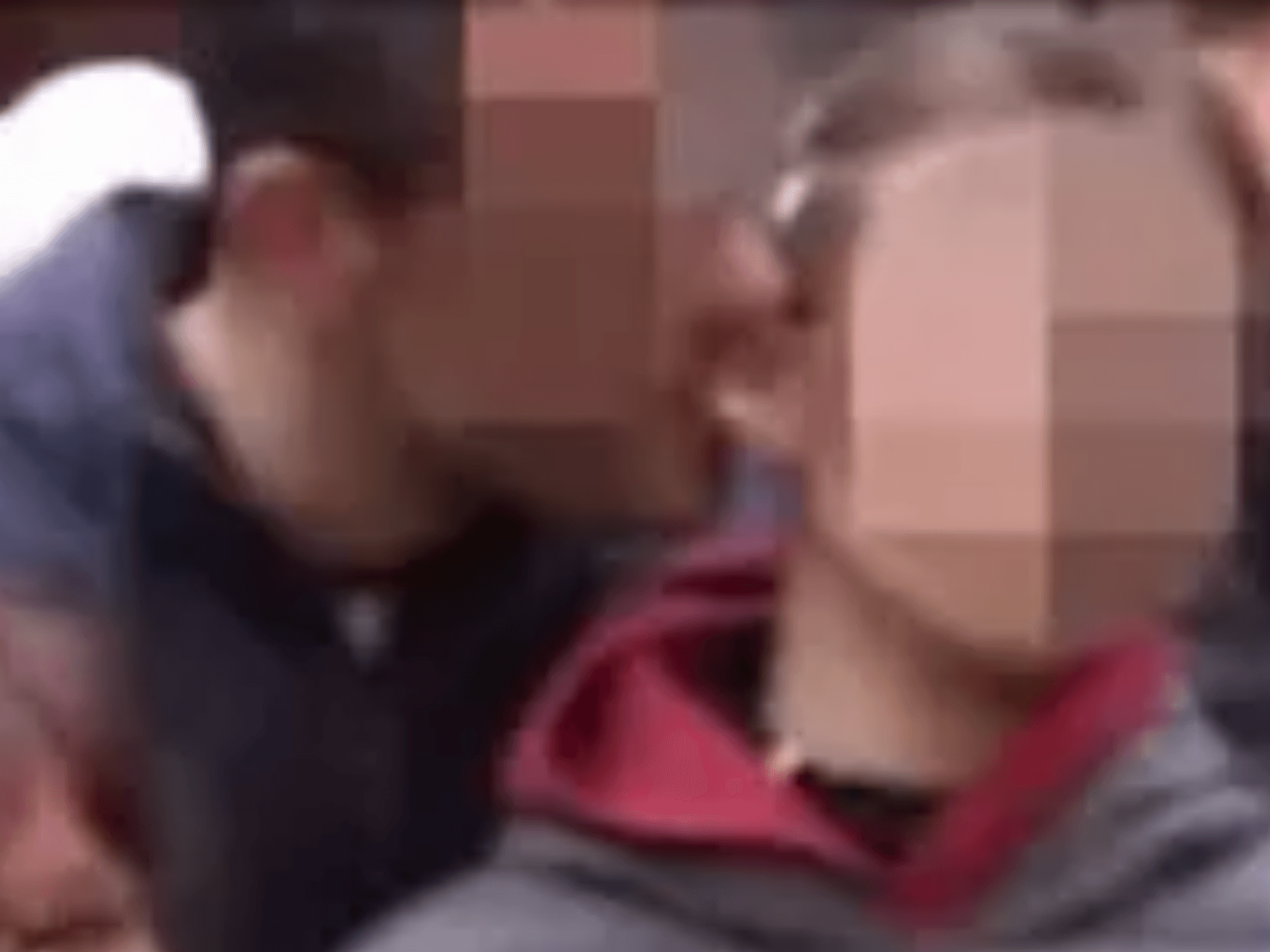 Man nibbling child's ear