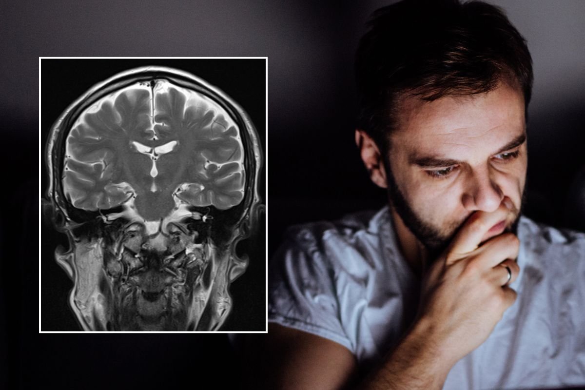 MAN ON COMPUTER AND BRAIN SCAN