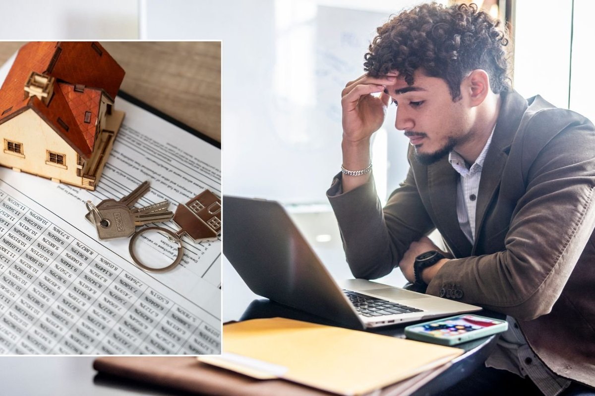 Man on computer and mortgage deal