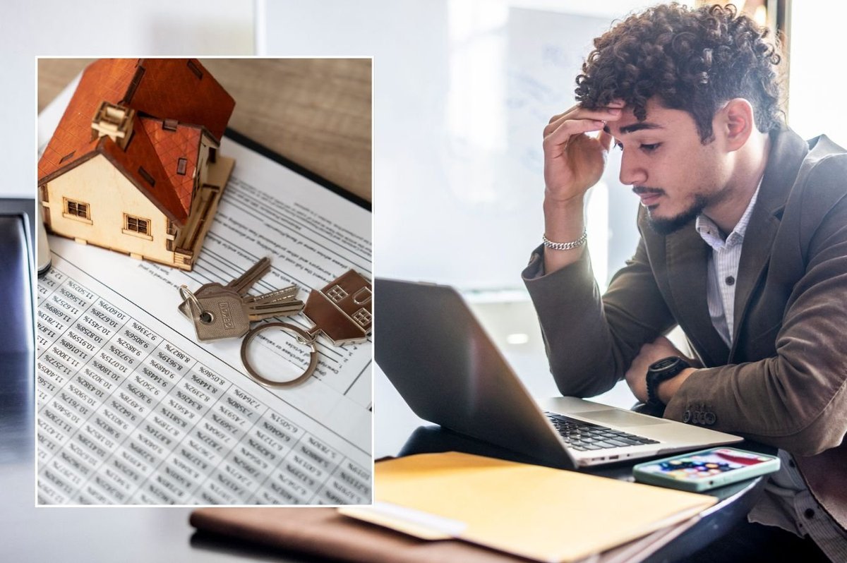 Man on computer and mortgage deal