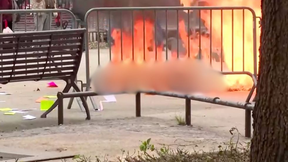 Man on fire outside Trump trial