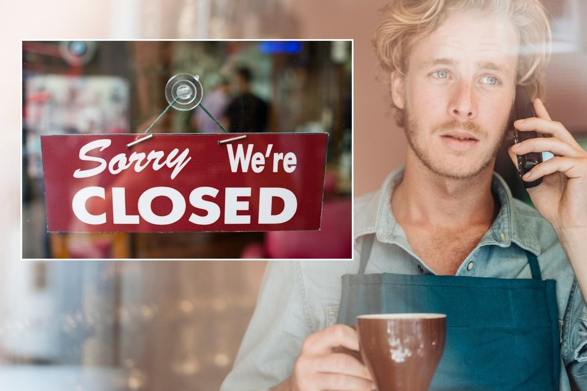 Man on phone and closed sign