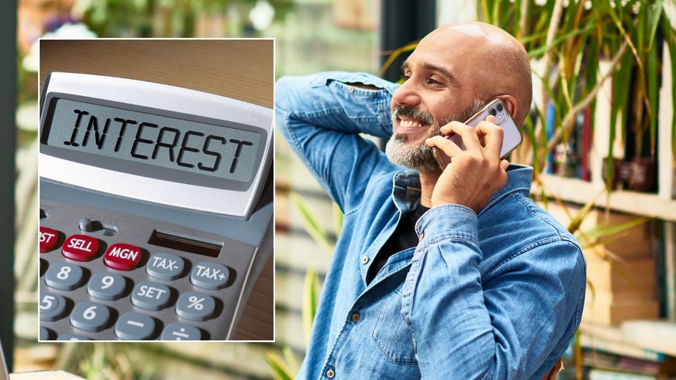Man on phone and interest rate on calcualtor