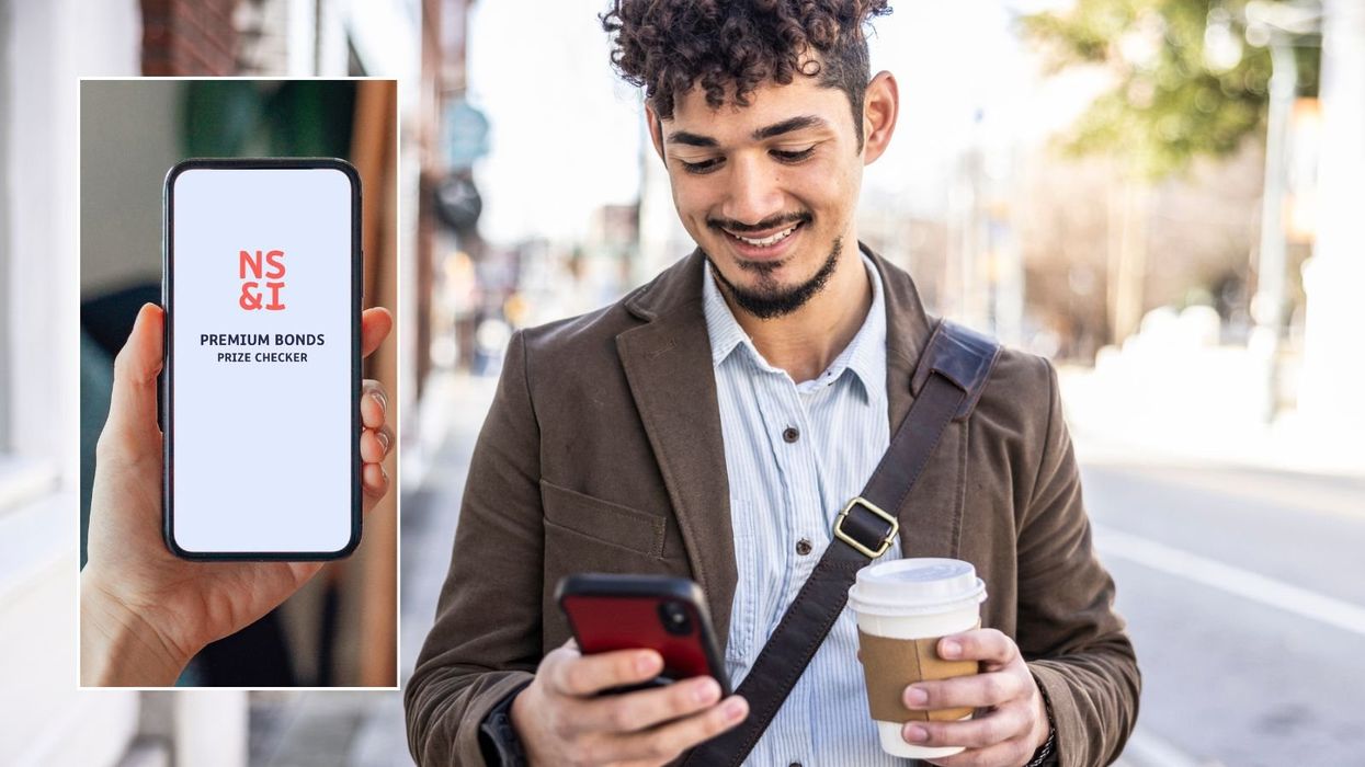 Man on phone and NS&I Premium Bonds prize checker