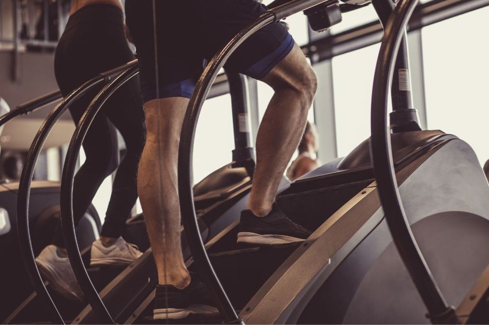 Man on stair climbing machine