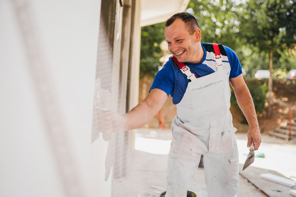 Man painting house