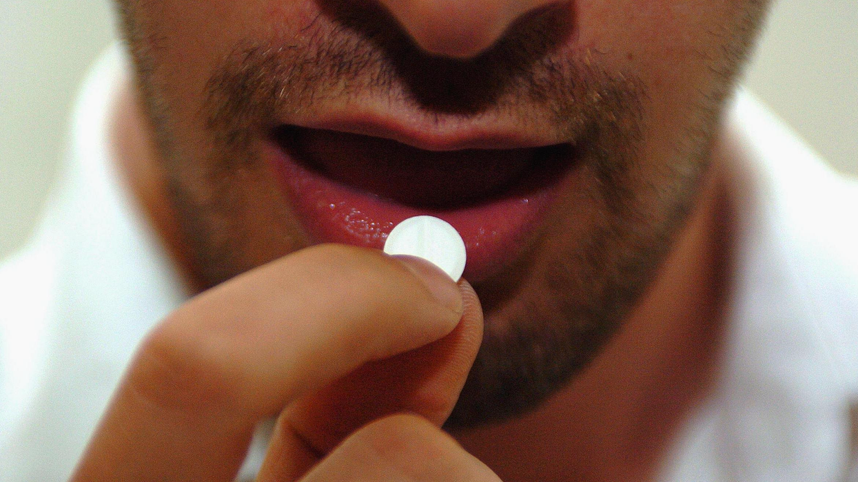Man popping a pill