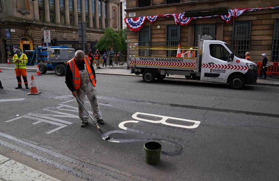 Man repainting road markings