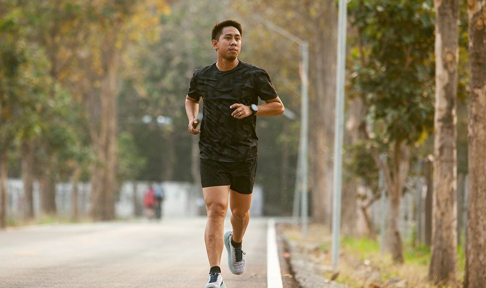 Man running through a park