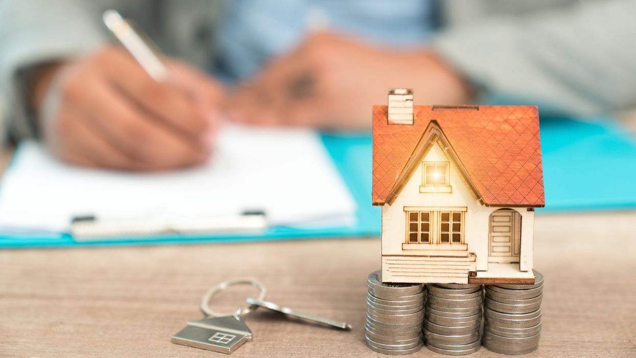 Man signing documents – buying a house concept