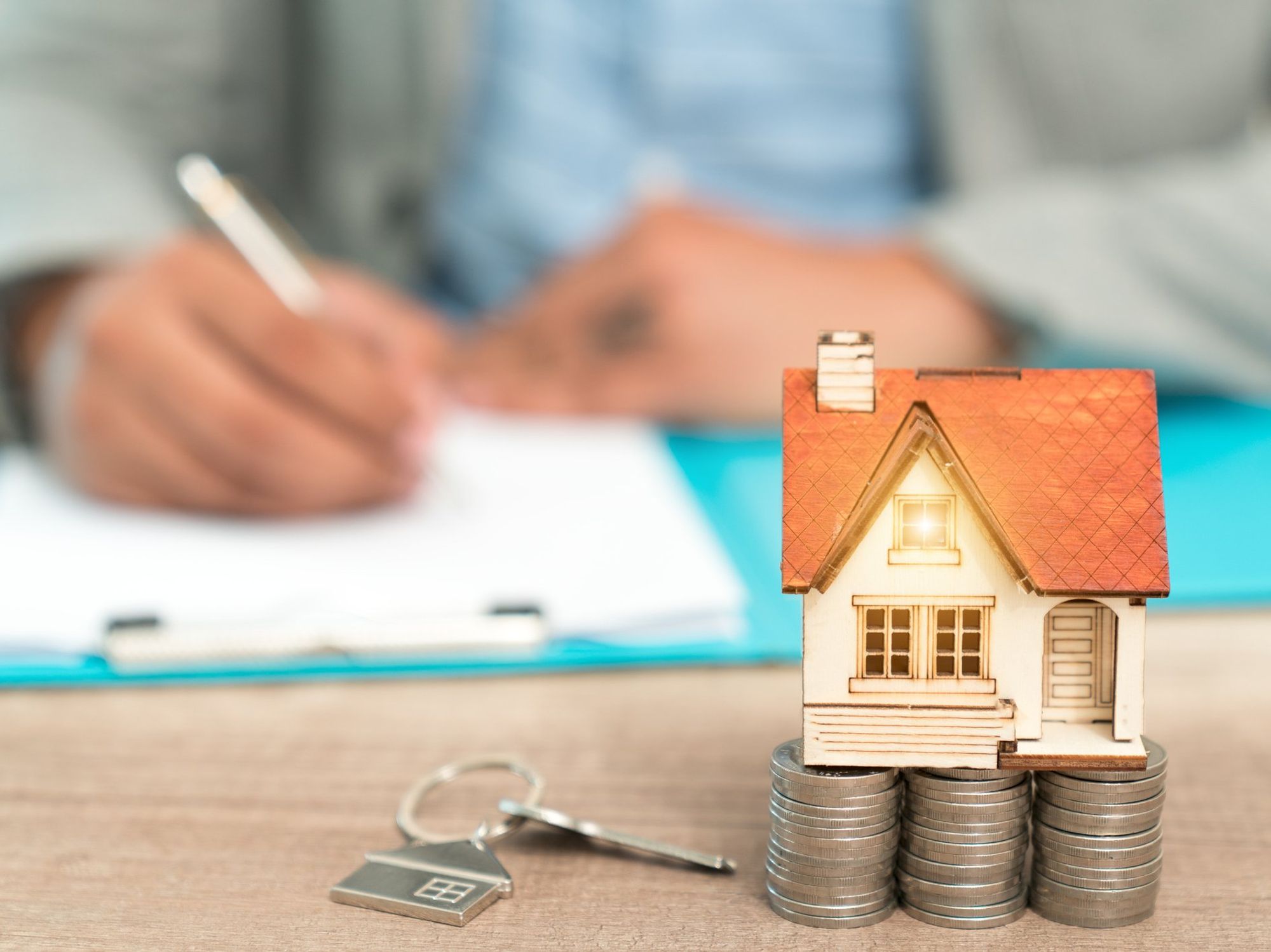 Man signing documents – buying a house concept