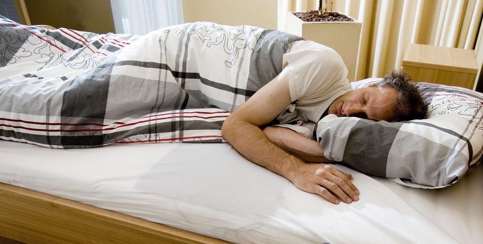 Man sleeping in bed