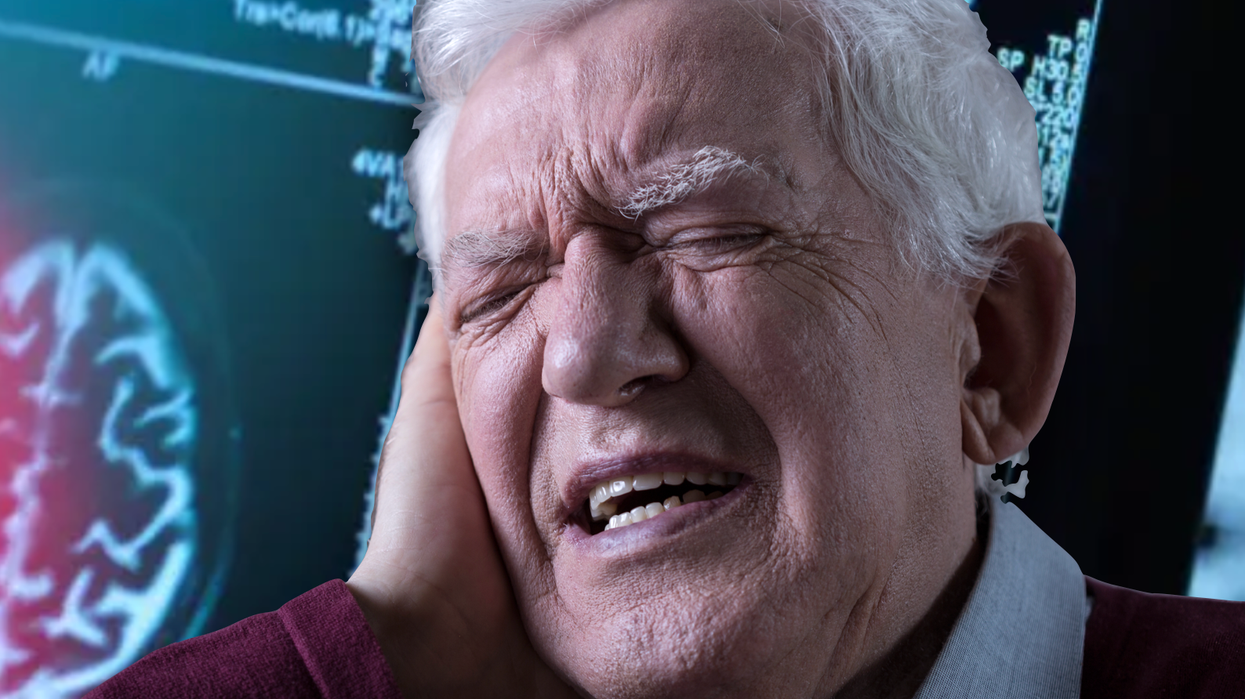 Man standing in front of a brain scan