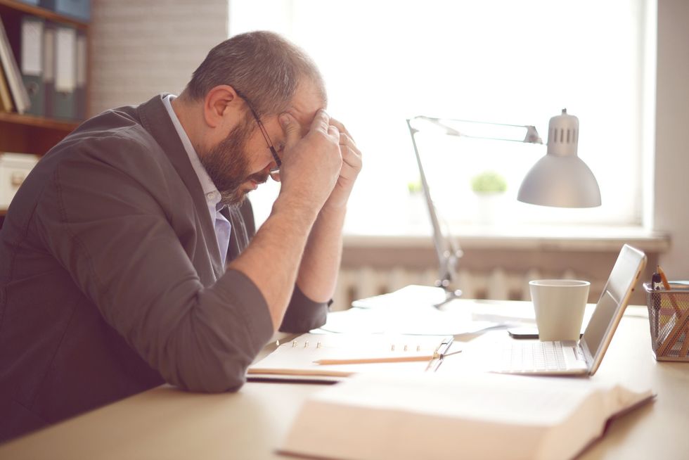 Man stressed at desk