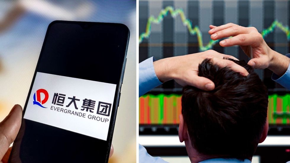 Man stressed looking at market and Evergrande Group logo