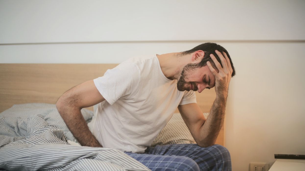 Man stressed on bed