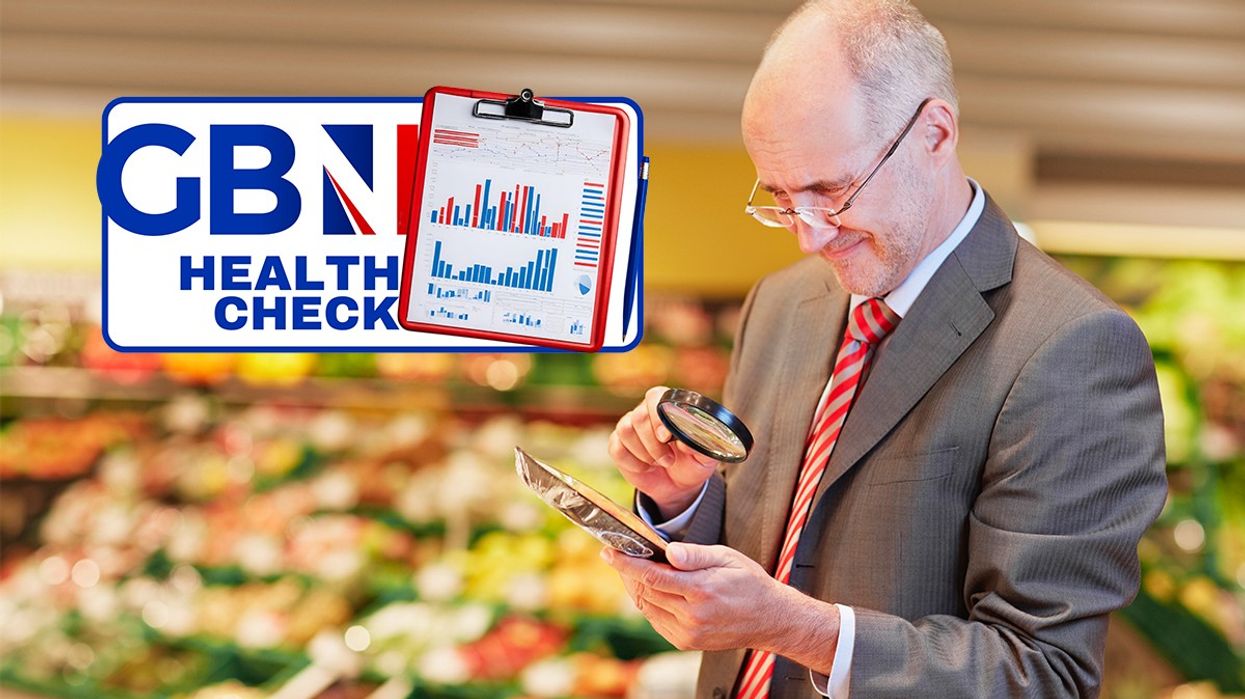 Man studying food in a shop with a magnifying glass