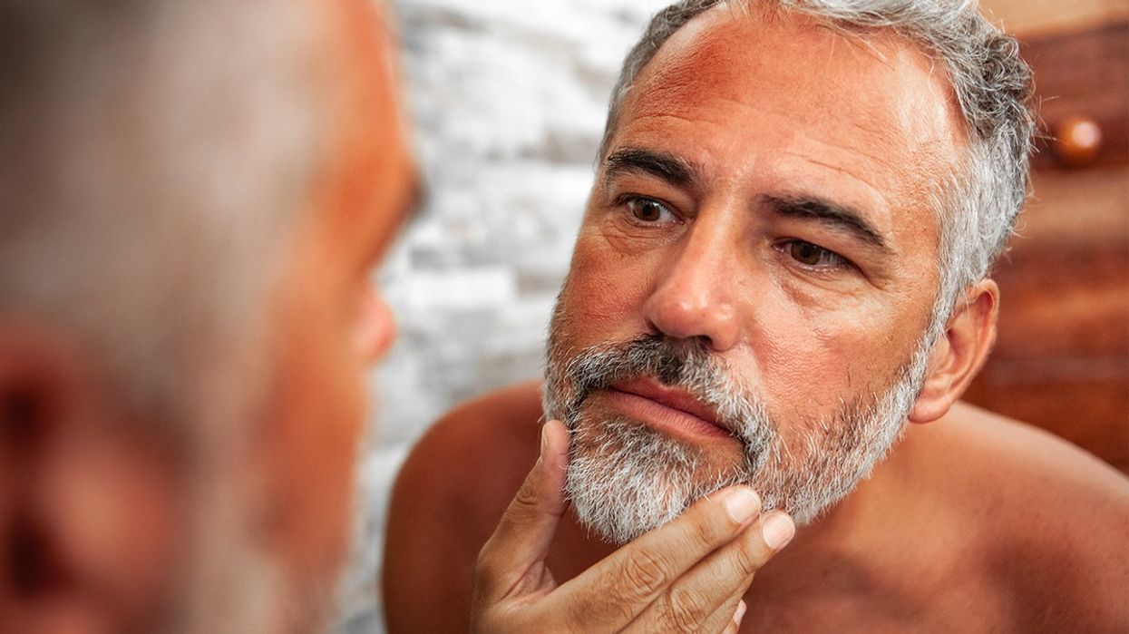 Man studying himself in the mirror