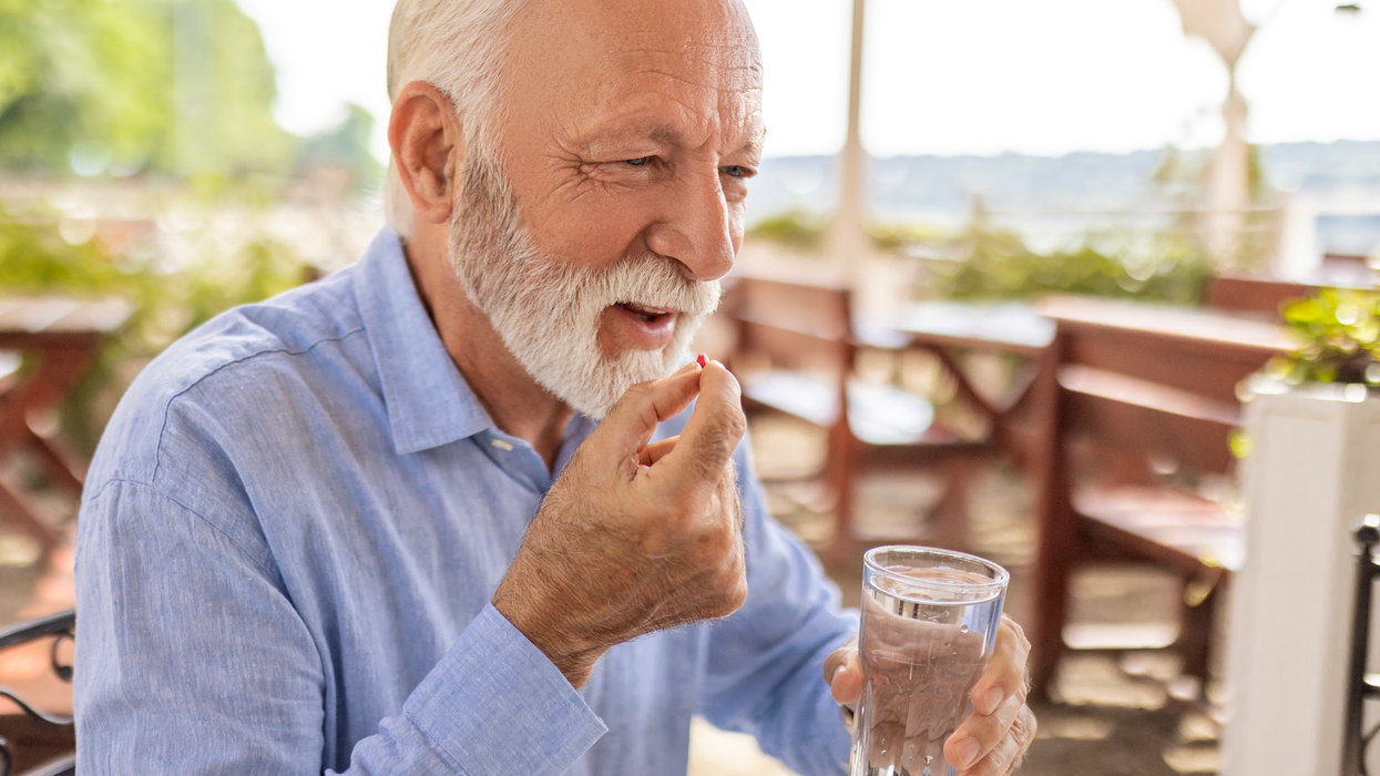 Man taking a supplement
