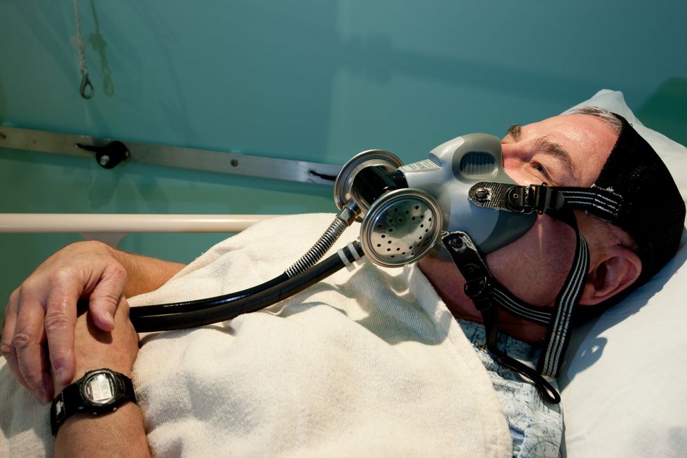Man undergoing hyperbaric oxygen therapy (HBOT)