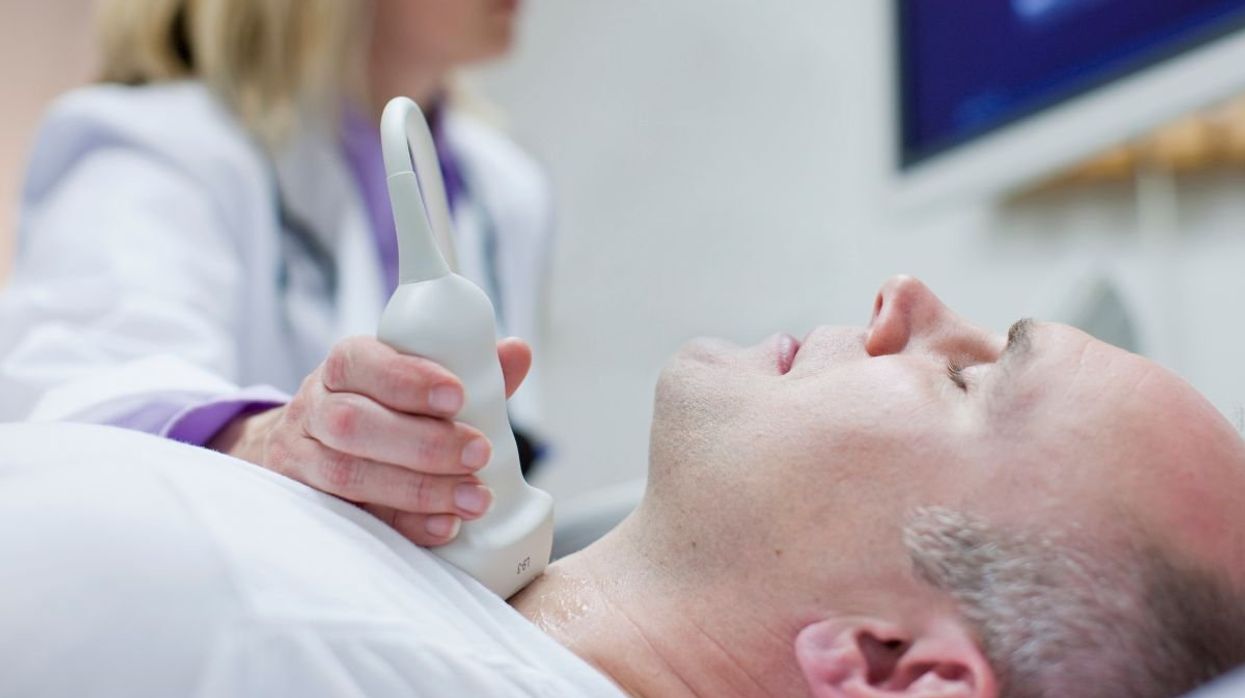 MAN UNDERGOING NECK SCAN