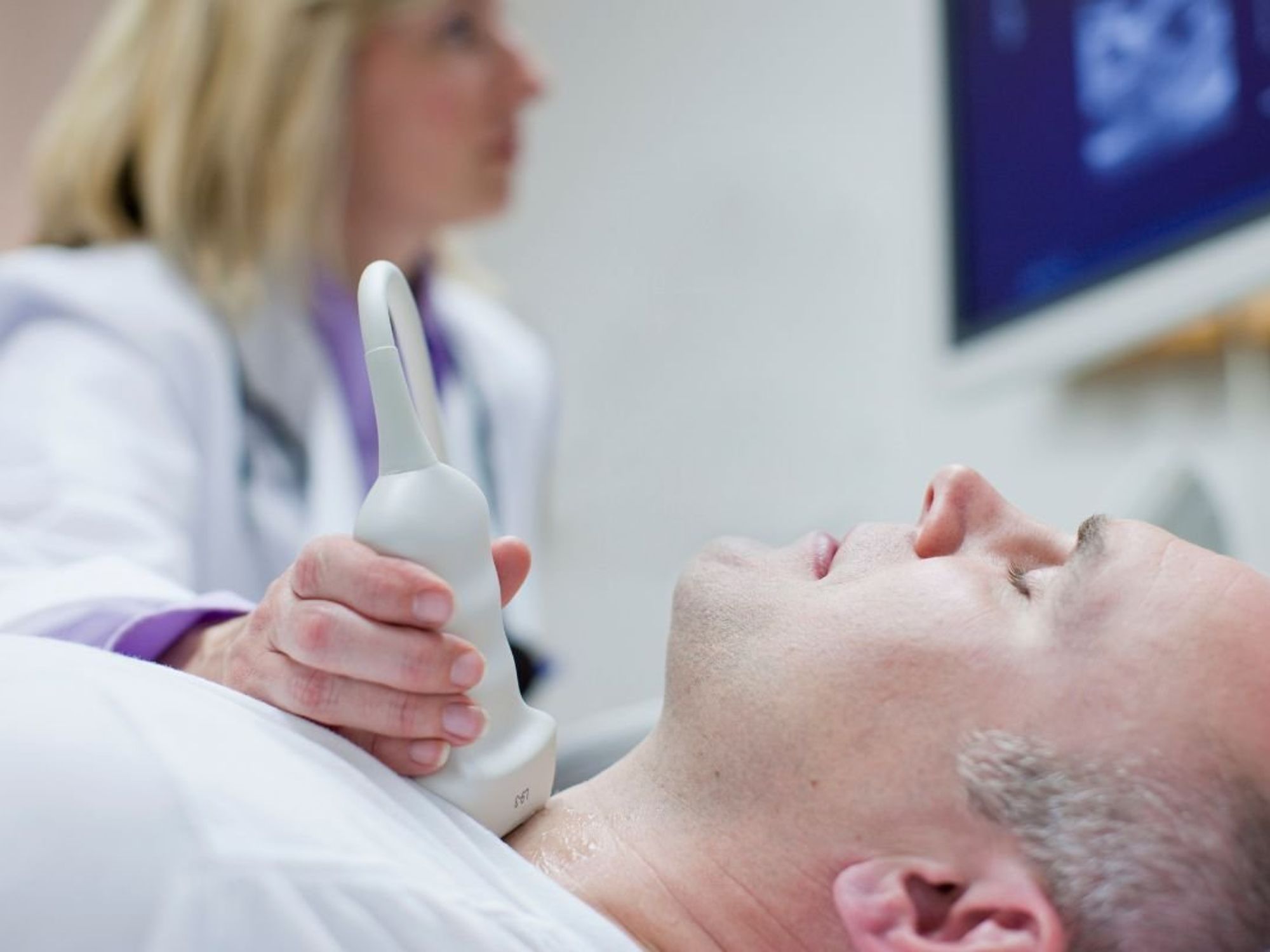 MAN UNDERGOING NECK SCAN