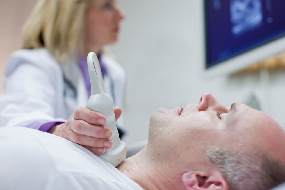 MAN UNDERGOING NECK SCAN