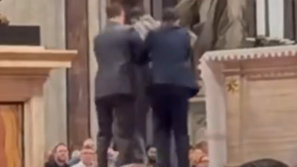 Man urinating at St Peter's Basilica dragged away