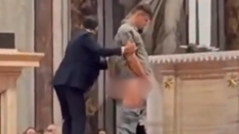 Man urinating at St Peter's Basilica