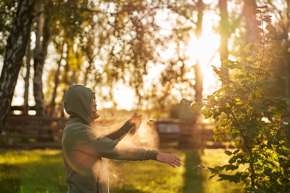 Man using insect repellent