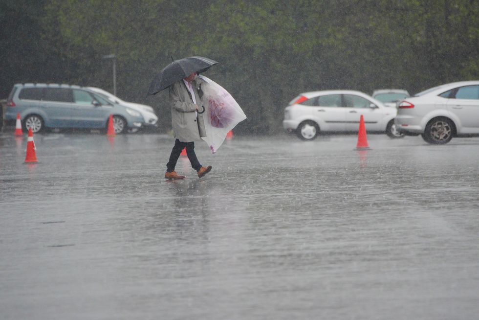 Man walking in the rain