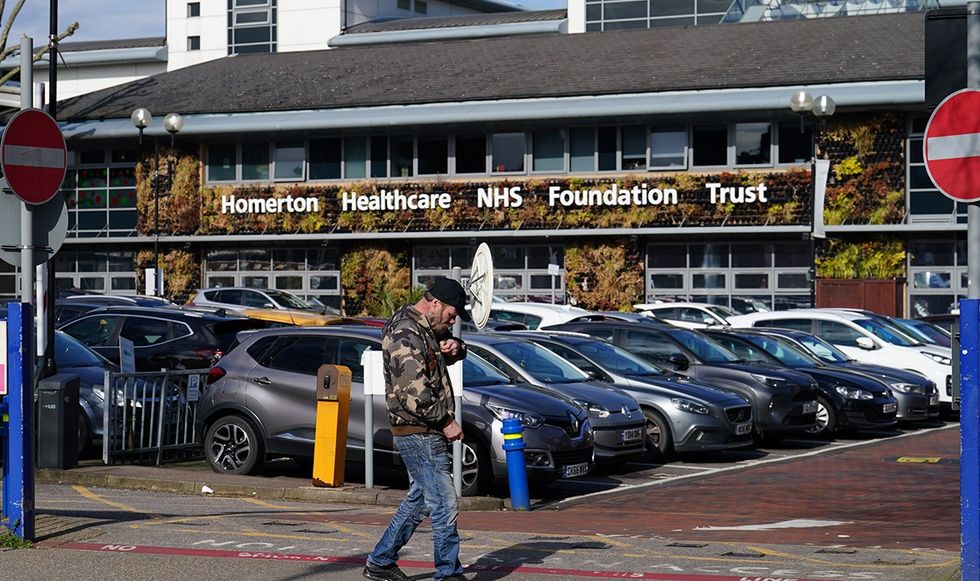 Man walking outside of an NHS clinic