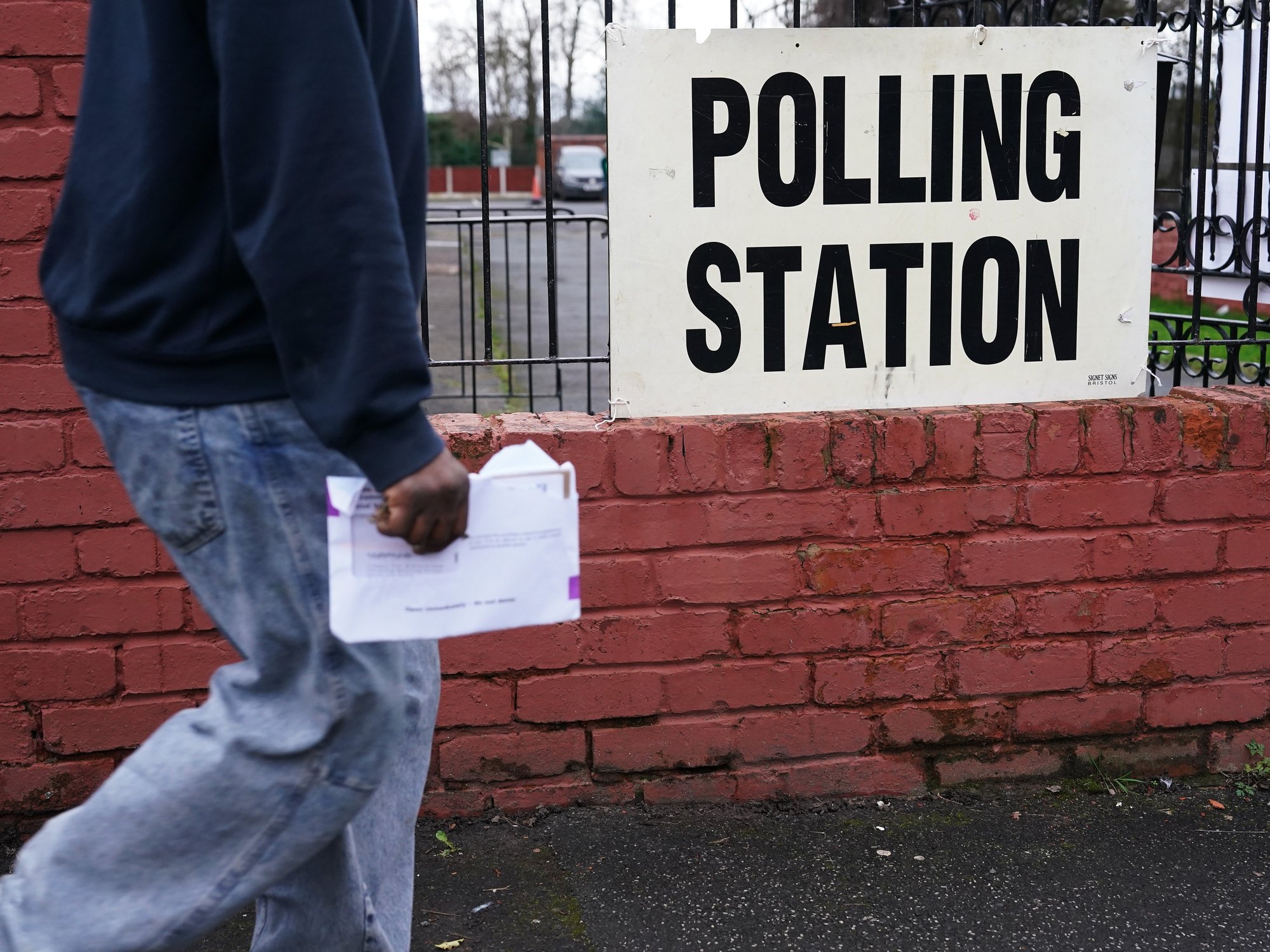 man walking to polling station