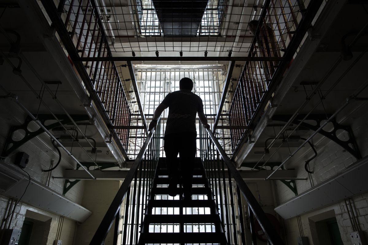 Man walking up stairs in British prison