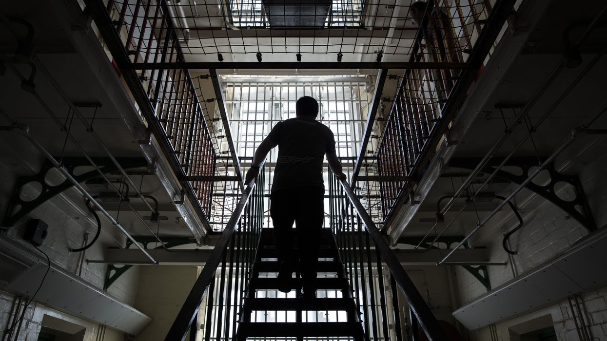 Man walking up stairs in British prison