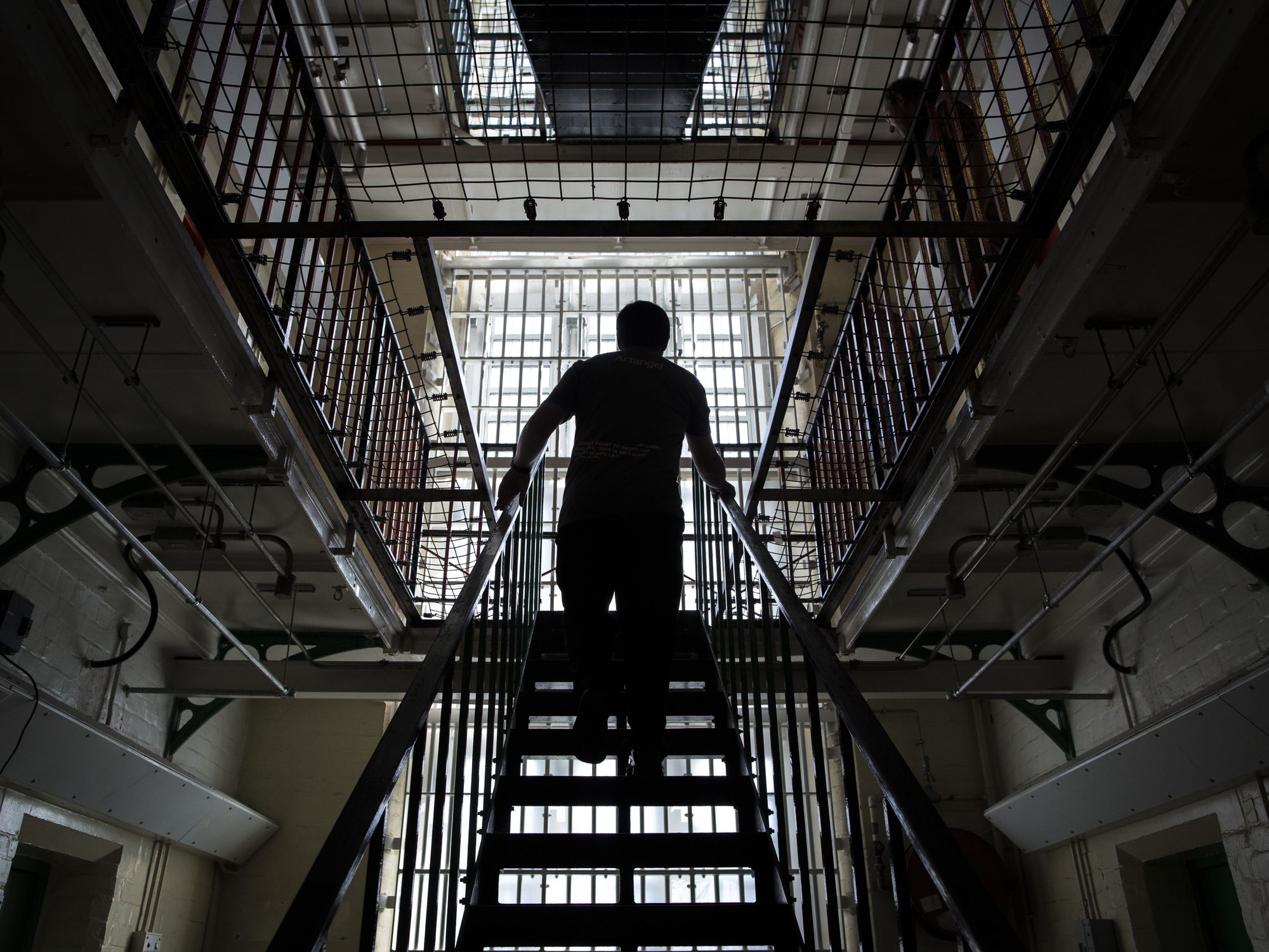 Man walking up stairs in British prison