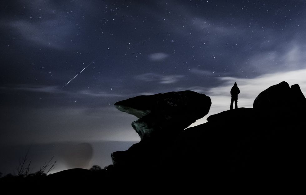 Man watches meteor shower