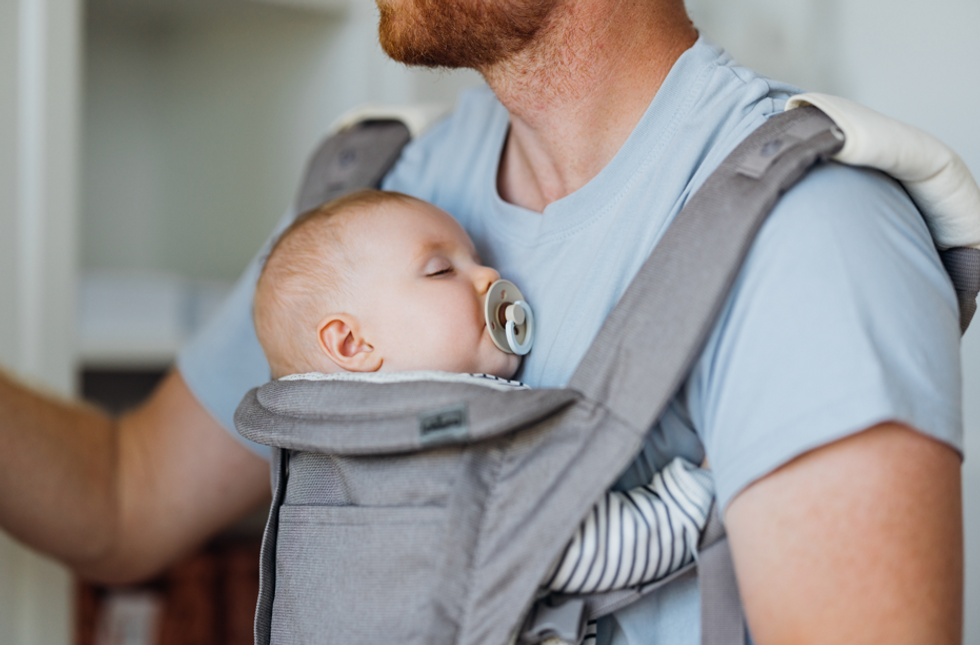 Man with baby in baby carrier