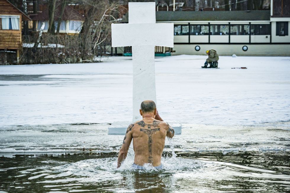 Man with cross tattoo