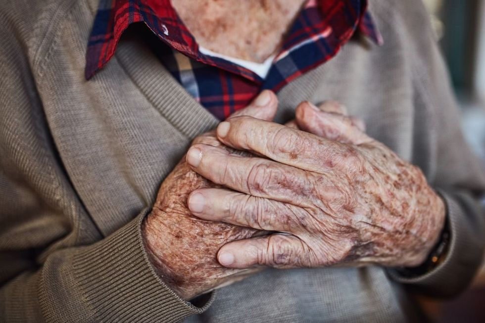 Man with hand over heart