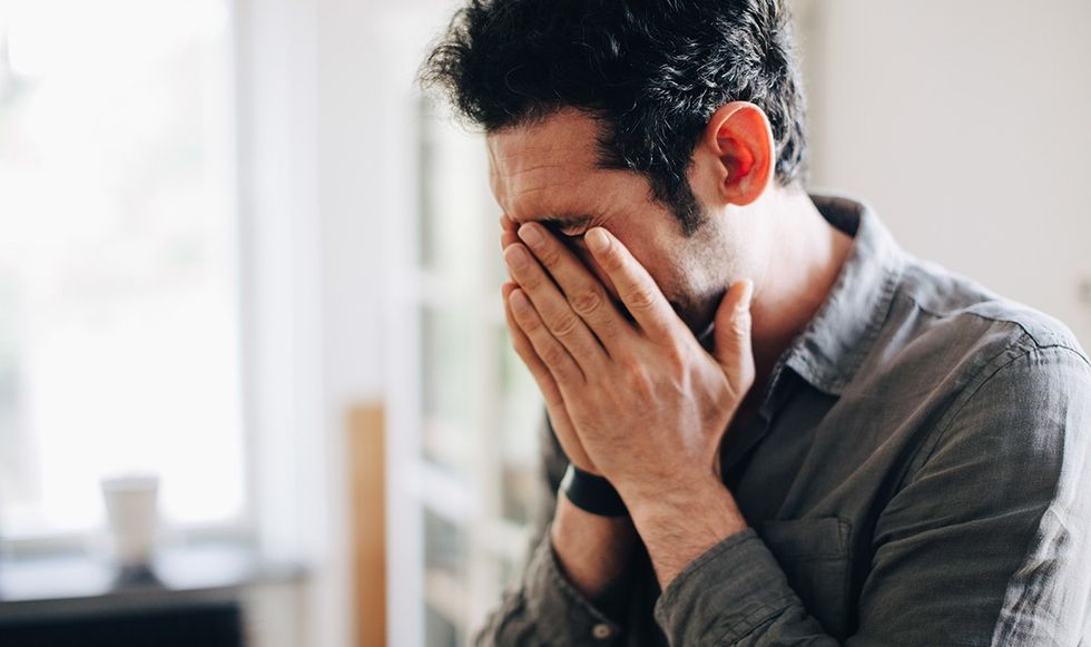 Man with his head in his hands