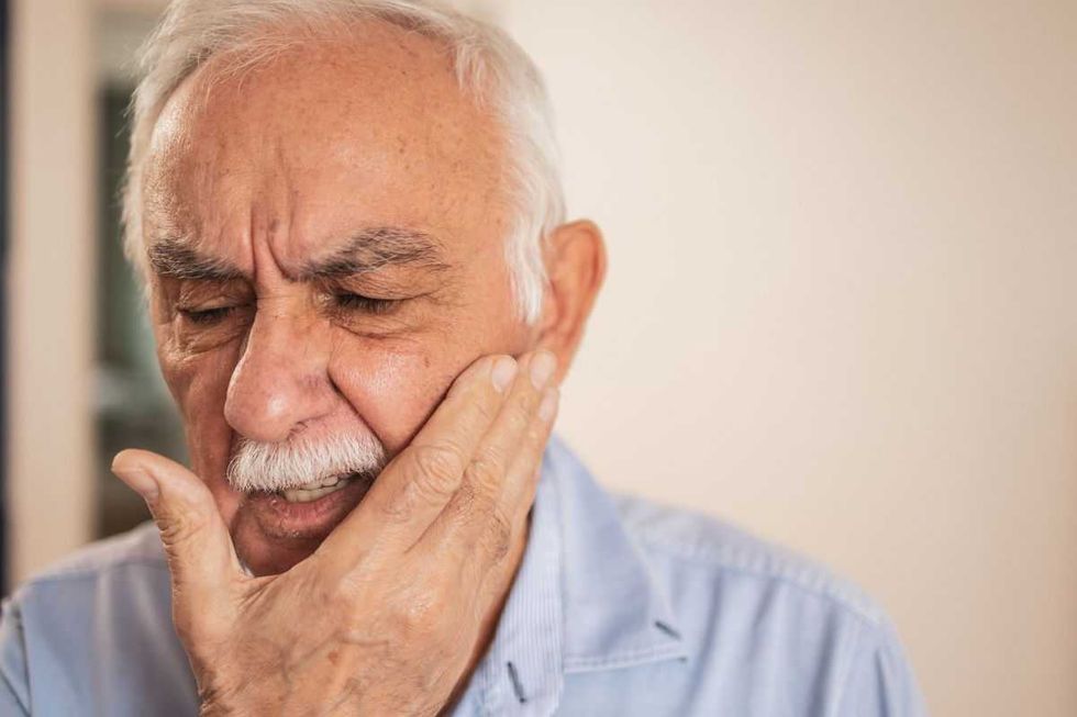 MAN WITH MOUTH PAIN